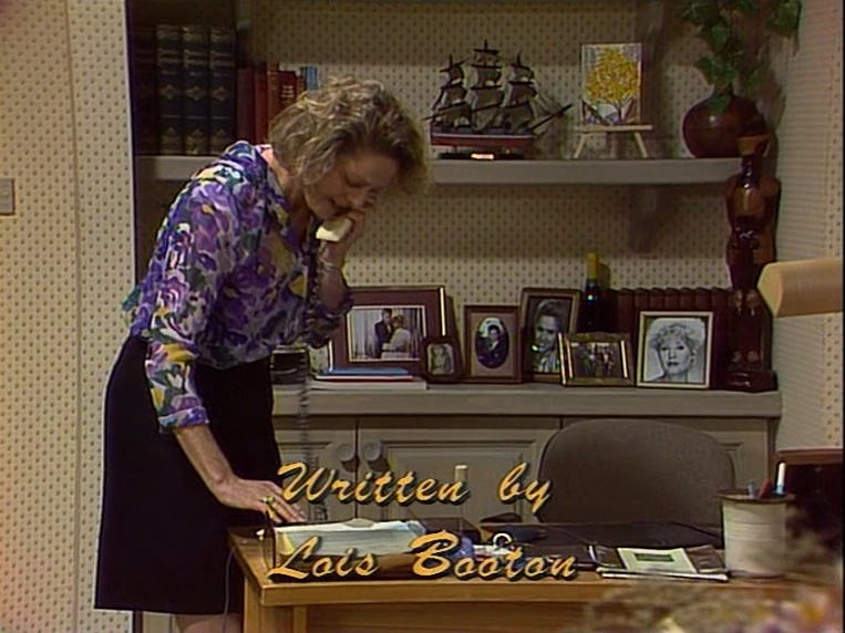 Neighbours screencap with the text "Written by Lois Booton" overlaid.