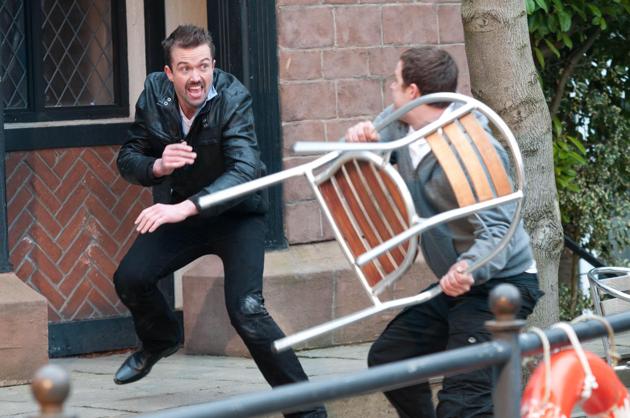 Brendan defends himself as Warren tries to throw a patio chair at him.
