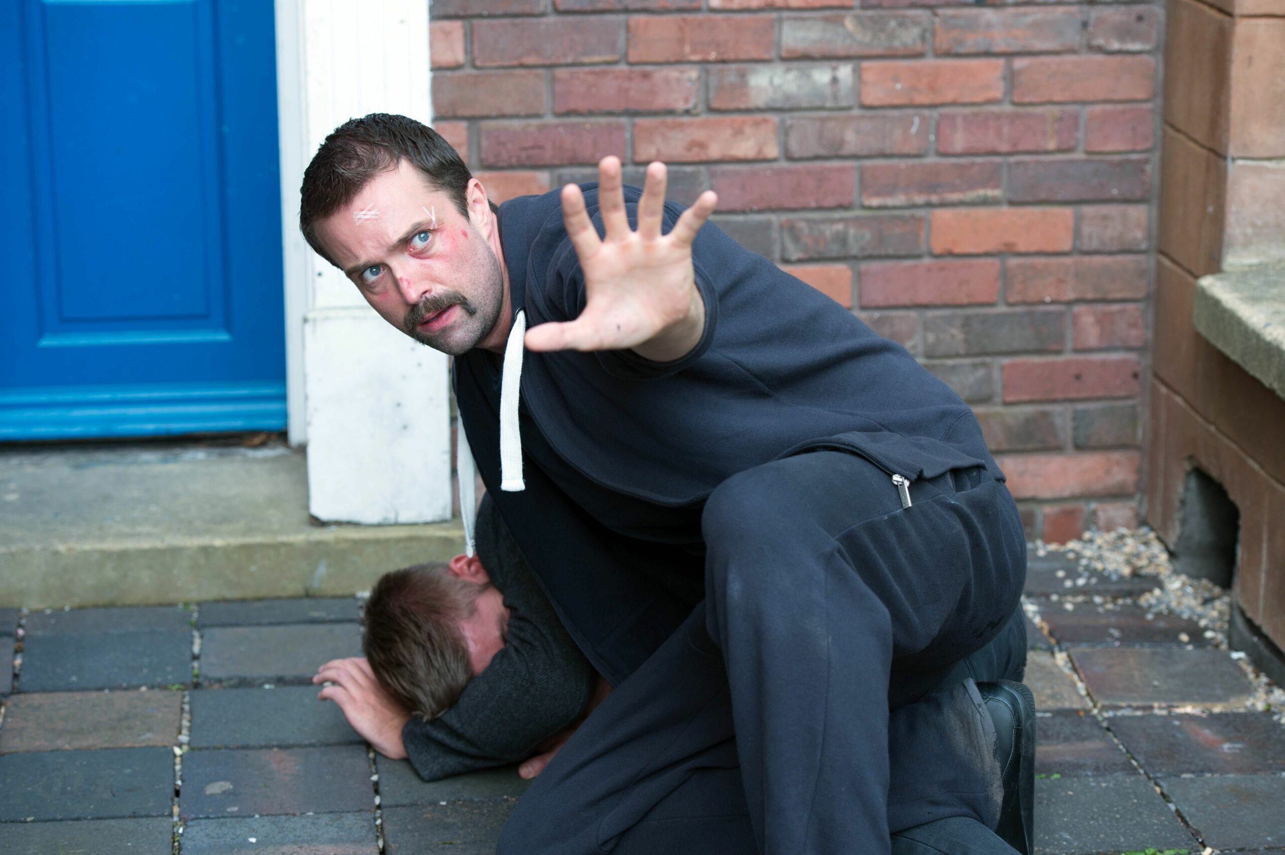 Brendan acts as a human shield to Ste when Walker points a gun at him.