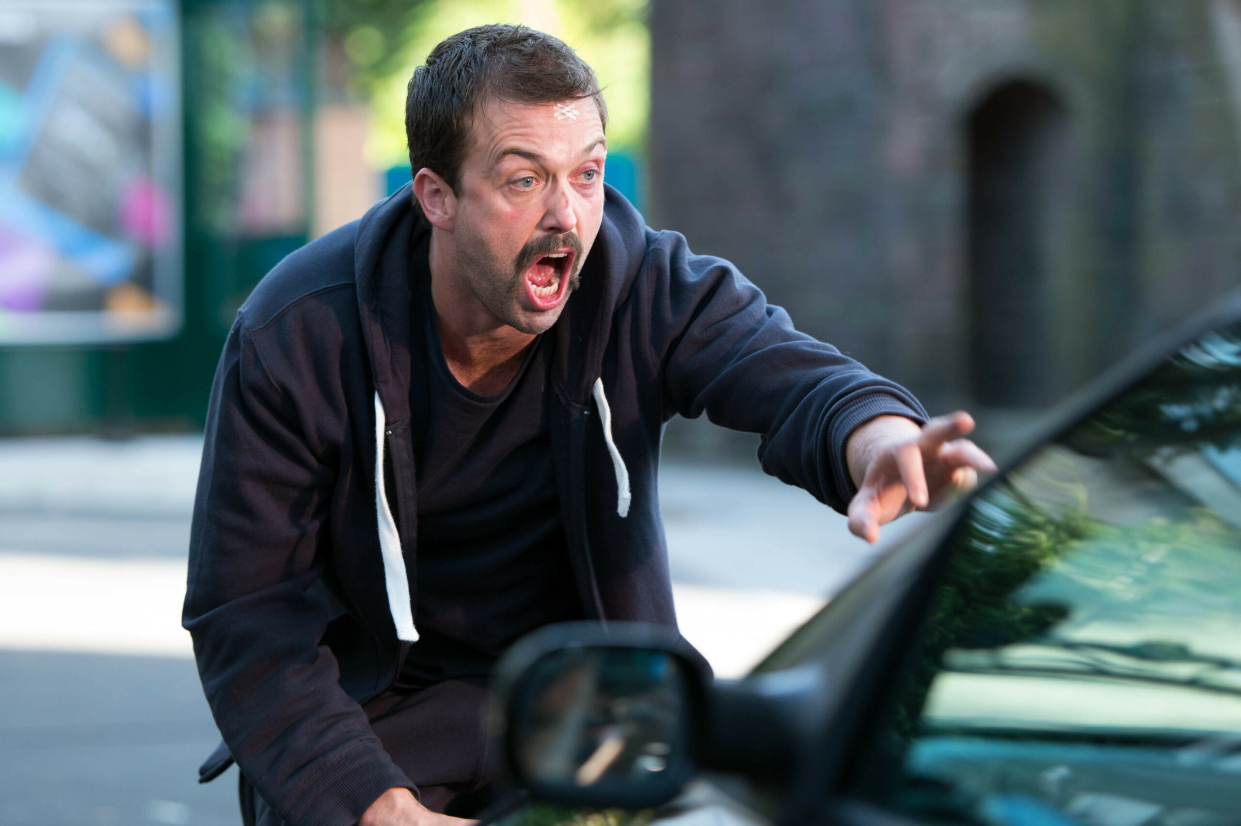 Brendan tries to stop a car in a moment of panic.