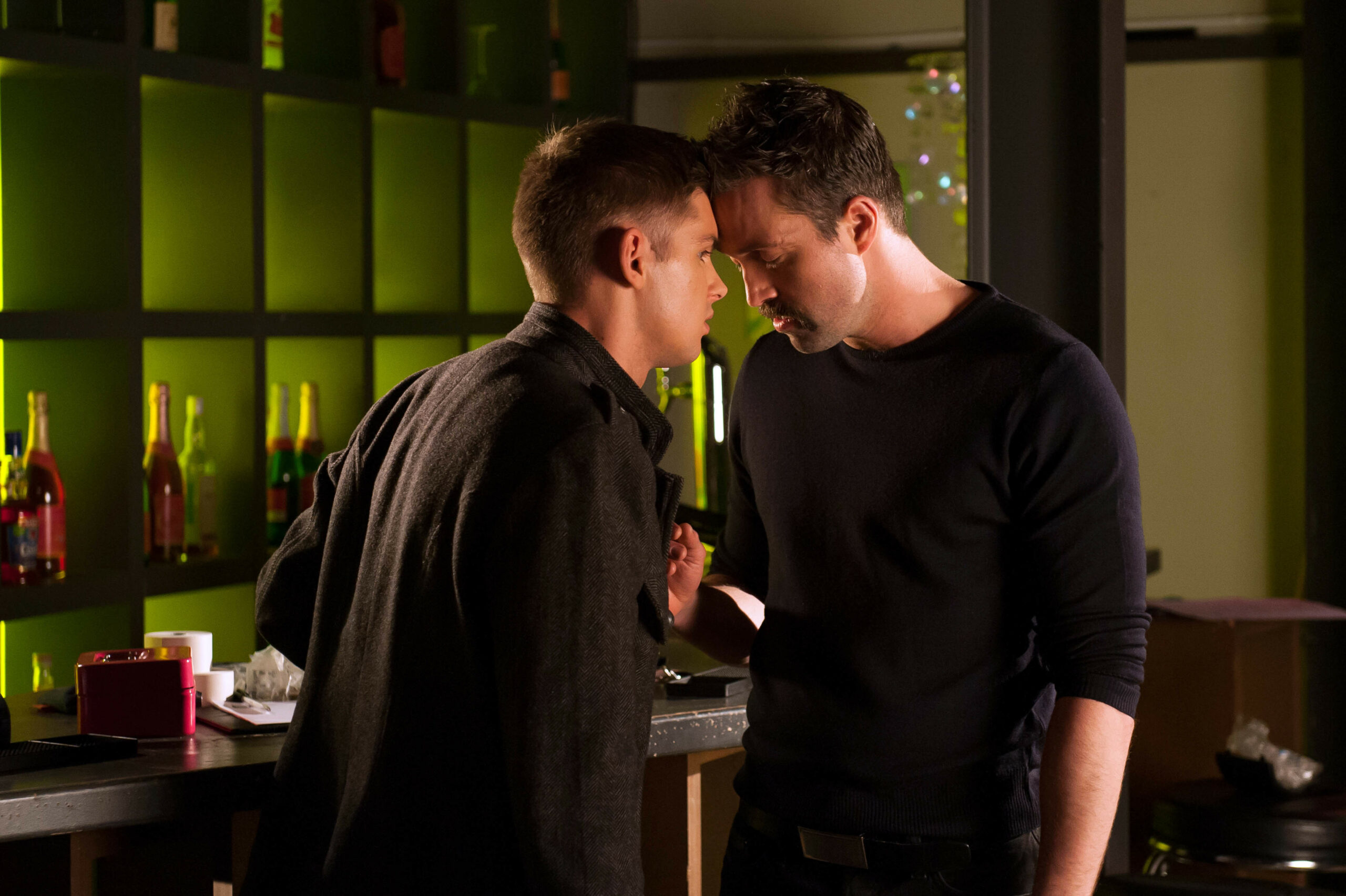 Brendan rests his forehead on Ste's in the night club.